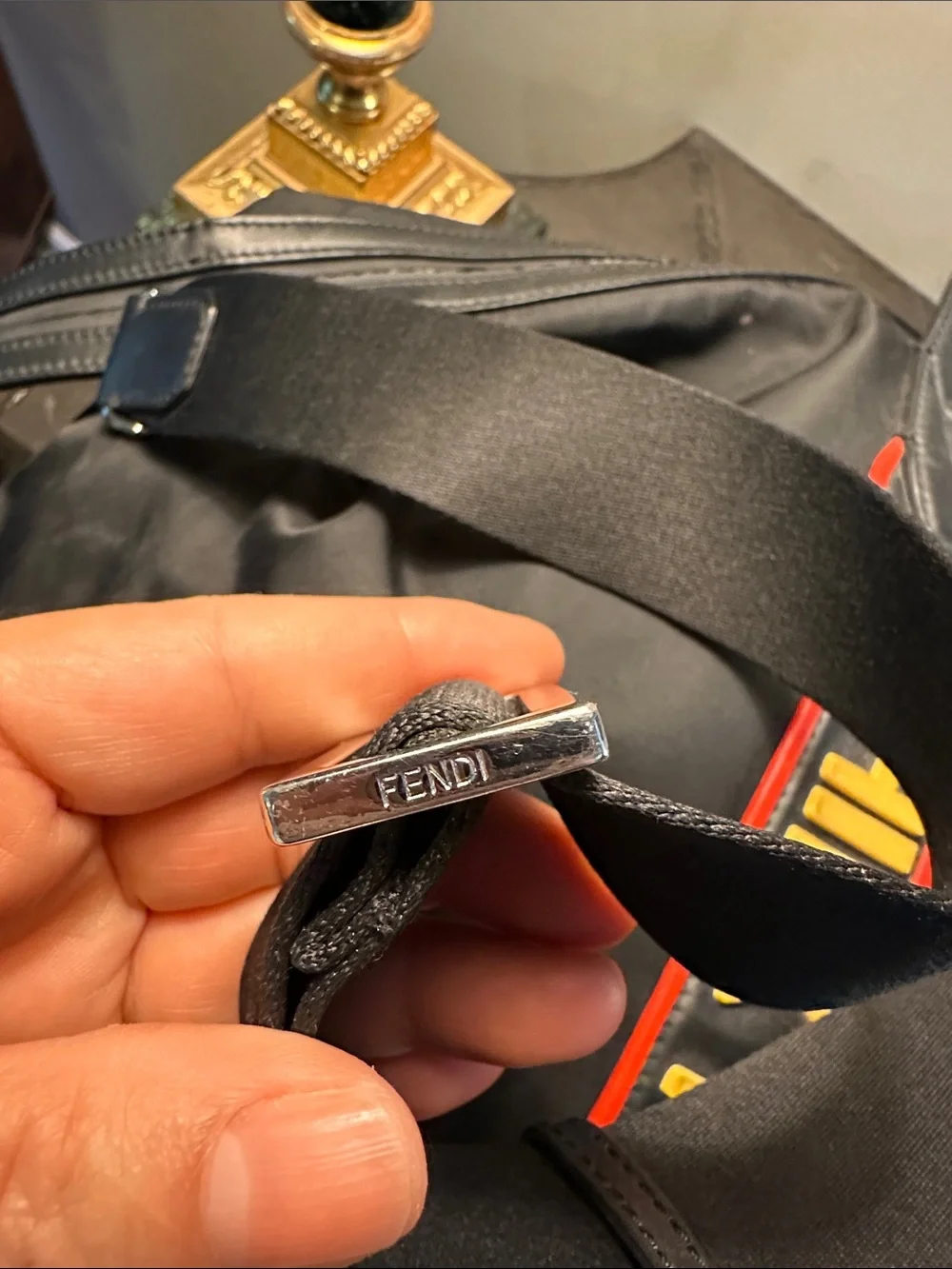 Fendi Black Duffel Bag with Yellow and Red Logo Straps